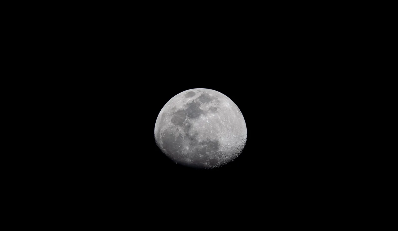 A detailed view of the moon against a black night sky